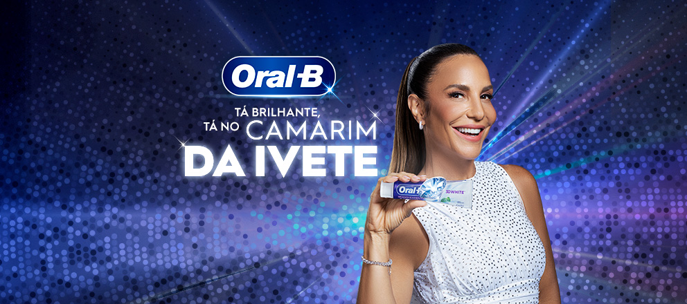 Banner do concurso Vem que é Oral-B da Oral-B em parceria com Ivete Sangalo. No centro da imagem, a cantora aparece sorrindo, usando um vestido branco de brilho, segurando uma escova dental Oral-B em destaque. Ao fundo, há um cenário em tons de azul e roxo com efeito de luzes e brilho. À esquerda, estampa o logotipo da Oral-B acompanhando do slogan “Tá brilhante Tá no Camarim da Ivete”. Texto do site: experimenteoralb.com.br.